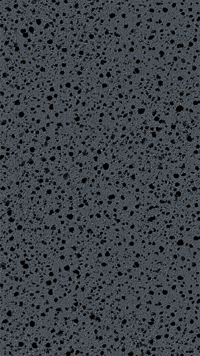深灰色背景，布满密集且大小不一的黑色小点，形成粗糙的颗粒质感，整体呈现均匀分布的纹理效果，无明显图案或形状，保持简约的单色噪点风格。