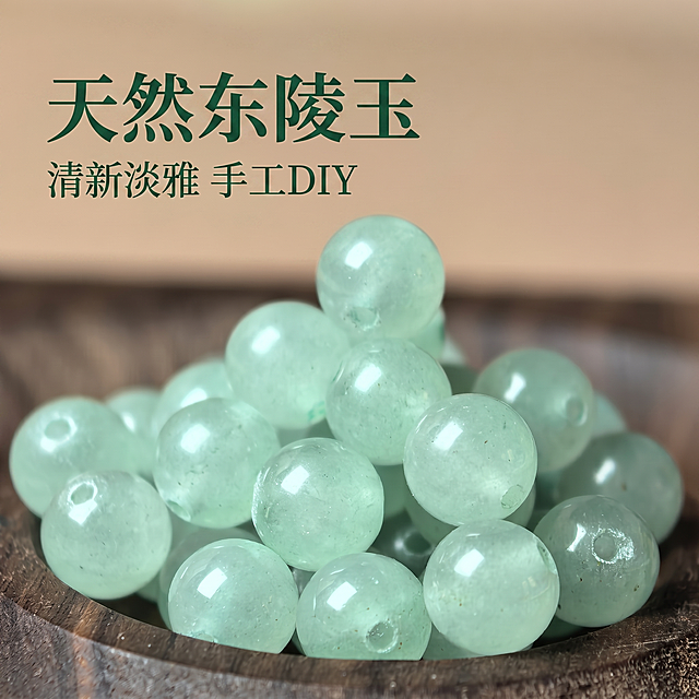 使用电商主图技能生成5张比例1:1的电商主图，适配平台为淘宝/天猫，商品为「图片1」「图片1」「图片1」「图片1」「图片1」，商品卖点为商品名称: 天然东陵玉散珠（或东陵玉圆珠） 商品描述: 商品为浅绿色的圆形珠子，材质看起来是天然东陵玉（或类似玉石类材质），珠子表面光滑透亮，带有一定的天然纹理和色泽变化，可能带有细微的绿色斑点或纹理，呈现出清新淡雅的色调。珠子是标准的圆形，孔径均匀，便于穿线制作手链、项链、耳环等饰品。使用方式主要是通过穿线（如弹力线、鱼线、钢丝绳等）将珠子串联起来，可根据个人喜好设计成不同款式的首饰，也可用于手工DIY创作，如串珠工艺品、家居装饰等。商品图片中展示了不同角度的珠子，包括成串的珠子和散落的单颗珠子，背景有木质容器、布质衬底和装饰性植物（如樱花枝），营造出自然雅致的氛围，适合用于展示珠子的质感和颜色。 目标受众: 主要针对喜欢手工DIY的爱好者，包括手工串珠爱好者、首饰设计师、手工艺从业者等，年龄层可能在18-45岁之间，对玉石类饰品有偏好，追求自然美感和个性化创作；也包括喜欢佩戴天然玉石饰品的人群，如注重传统文化、喜欢简约清新风格的女性，以及收藏天然玉石珠子的爱好者。 商品卖点: [1. 天然材质，色泽清新：珠子采用天然东陵玉（或类似玉石）材质，浅绿色调清新淡雅，带有自然纹理，每颗珠子都有独特的质感和色泽变化，具有天然玉石的温润感与美观性；2. 工艺精细，孔径均匀：珠子表面光滑透亮，圆形规整，孔径大小一致且均匀，便于穿线和DIY创作，确保串制的饰品结构稳固且美观；3. 百搭实用，DIY属性强：珠子可用于制作手链、项链、耳环等各类首饰，也可用于家居装饰、手工摆件等，适配多种风格的设计需求，满足手工爱好者的个性化创作需求，同时天然玉石珠子也具备一定的收藏和佩戴价值。]，其他要求为第一张图作为主图第一张