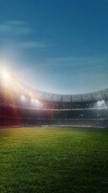 参考这张图片的构图和光影风格，重新生成画面，保留足球场、草坪、观众席和蓝天背景的氛围，去除所有文字内容和车辆内容，保留整体干净的赛场场景风格，光影和色调和原图保持一致预览效果