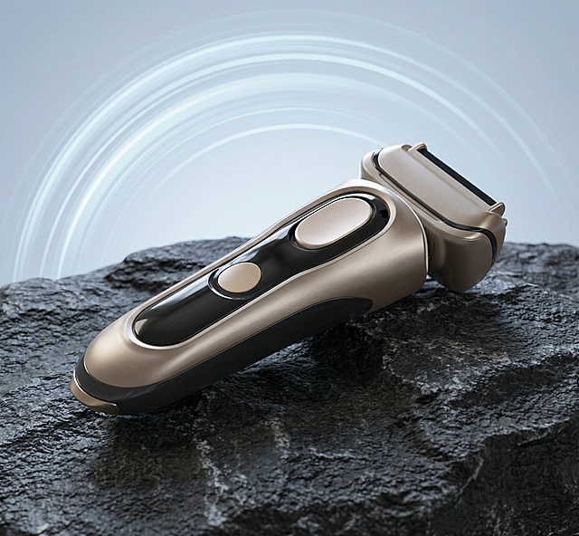 「图片1」主体为电动剃须刀，悬浮于深灰粗糙岩石上方；背景是浅淡渐变蓝，带有环形速度光效；风格为高端科技感产品摄影，冷色调为主，金属质感细腻；采用低仰角构图，突出产品精致与科技感，光线柔和凸显产品光泽。