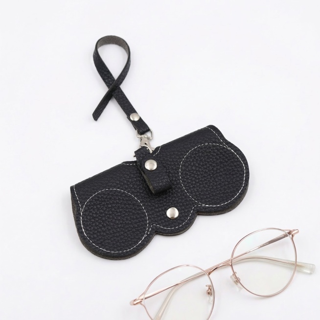Product shot of black leather sunglasses case on pure white background. Four-quarter side view, slig预览效果