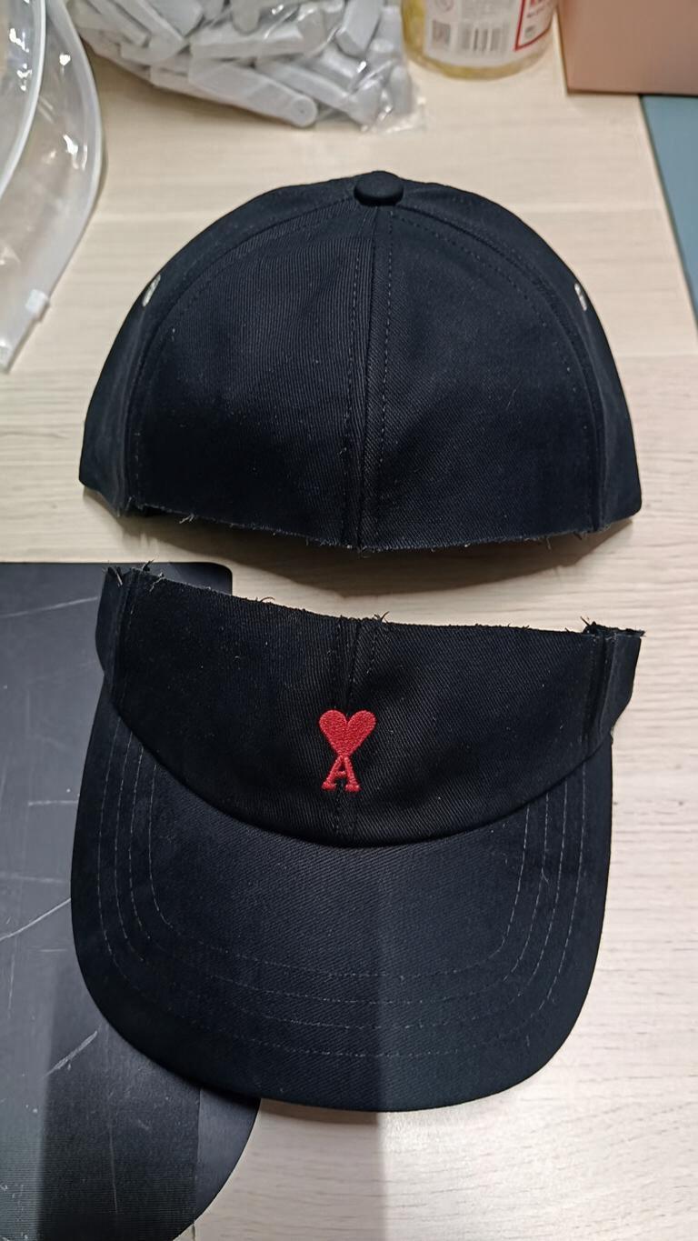 A black six-panel baseball cap… - 图片创意预览