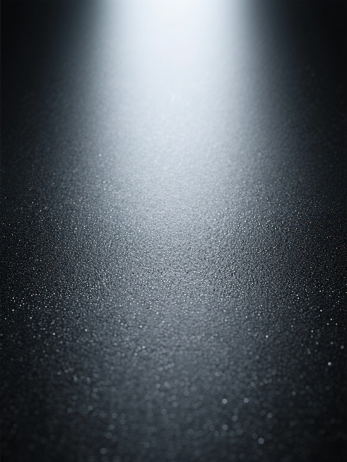 高清写实金属纹理背景，呈现细腻均匀的磨砂质感，整体为深灰色调，从顶部中央向四周呈现自然柔和的渐变光影效果，高光区域明亮柔和，无明显光源边界，暗部过渡平滑，表面布满细微密集的颗粒状肌理，具有强烈的工业风与现代感，材质表现为哑光金属特性，无反光镜面效果，纹理清晰且分布均匀，营造出冷峻、沉稳且专业的视觉氛围。预览效果