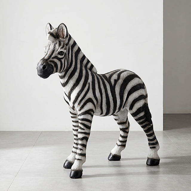 [Main Image 1] Zebra sculpture ornament hero shot in modern living room. [Atmosphere Style] Minimalist modern high-end home style, natural wild aesthetic. [Image Quality] Commercial photography texture, soft and transparent light, clear and realistic product, clean and advanced picture. [Elements] The zebra sculpture is placed in the entrance of a modern minimalist living room, with light gray tile floor and plain white wall background. The sculpture is the absolute visual center, the product shape, stripe color, material texture are exactly the same as the original image, 1:1 restore the zebra posture, black and white stripes are clear and natural, delicate features, mane, hoof details, lifelike expression. The product occupies 85% of the picture, full screen without border. [Light and Shadow] Soft indoor main light from the front side, bright and even exposure, natural projection shadow, highlight the three-dimensional texture of the sculpture. [Color Matching] Main color: black and white, auxiliary color: light gray off-white. [Perspective Composition] 45-degree elevation, full product outline not cropped, deep focus. [Text and Layout] No additional text allowed, comply with Amazon cross-border platform main image specification. [Proportion Resolution] 1:1 proportion, 2K resolution, ultra high definition. [Negative Prompt] Deformation, watermark, text clutter, blurred product image, messy background.