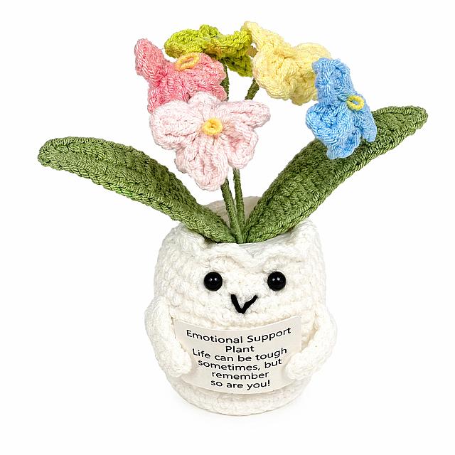 [主图-1] Handmade crocheted forget-me-not potted ornament in an owl-shaped pot on pure white background. Keep the original product appearance: white owl crochet pot, colorful forget-me-not flowers including pink, light pink, yellow, green and blue, green crochet leaves, the text "Emotional Support Plant Life can be tough sometimes, but remember so are you!" on the small sign remains unchanged. The product occupies 85% of the frame, centered and prominent. Commercial product photography quality, soft and even studio lighting, product clear and sharp, pure white #FFFFFF background, no shadows, clean and professional. Keep crocheted texture delicate, all colors consistent with the original image, no distortion. 1:1 square composition, super high definition 2K commercial photography quality. Negative prompt: deformation, text confusion, blurring, messy background, watermark, extra logos, Chinese characters.