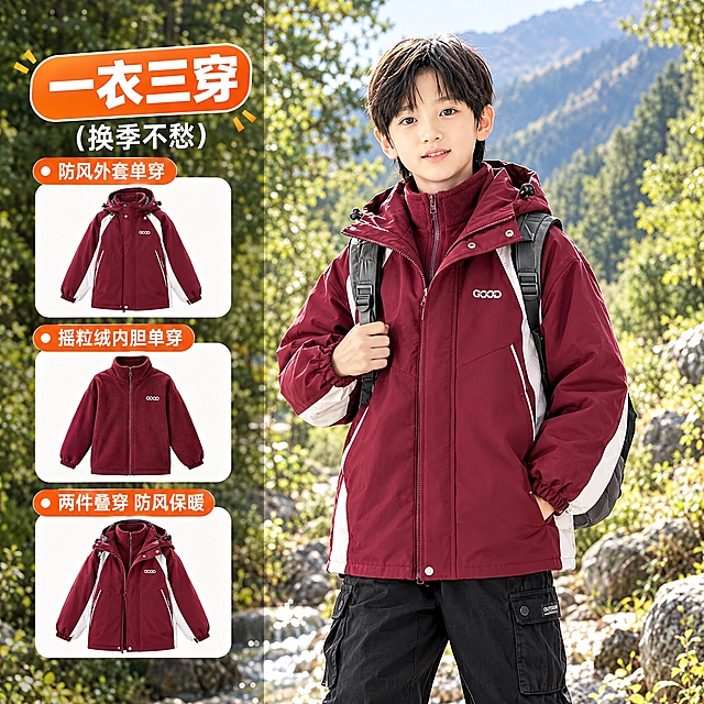儿童酒红色三合一冲锋衣电商主图，1比1正方形，淘宝天猫风格。画面左右分栏布局，右侧大面积是户外山林场景中穿着酒红色拼白条纹冲锋衣的小男孩模特，左侧竖排展示一衣三穿的三个款式小图和卖点文字。橙色标题写一衣三穿，三个小图分别展示外套单穿、摇粒绒内胆单穿、两件叠穿。自然山林背景，溪水岩石绿树，阳光柔和，商业摄影质感，高清清晰。