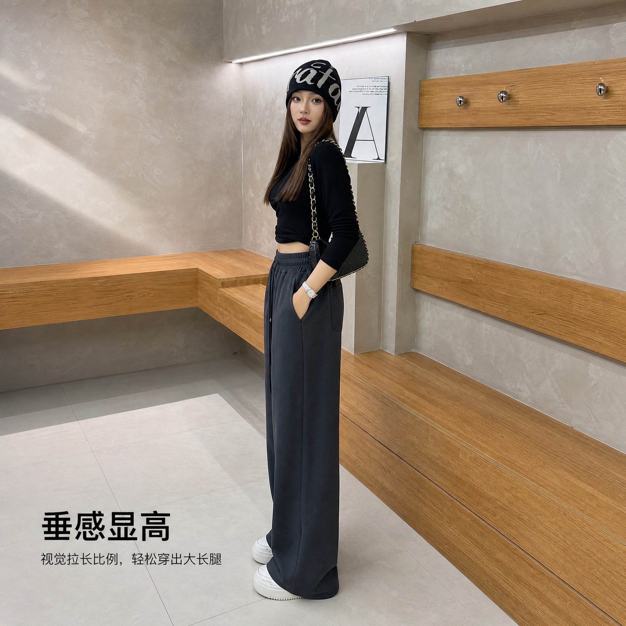 年轻女性模特侧身站立穿搭展示，灰色高腰直筒拖地裤，黑色短款上衣… - 图片创意预览