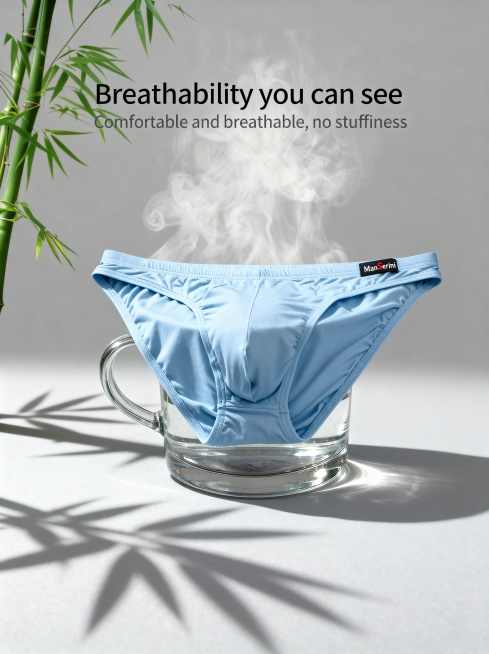 参考图1的构图和透气演示效果，将产品主体替换为图2款式的浅蓝色三角男士内裤，保持产品物理结构不变，保持原Logo文字不变。展示内裤覆盖在装满热水的玻璃杯上方，上方有袅袅热气透出，左侧保留青竹元素，背景预览效果