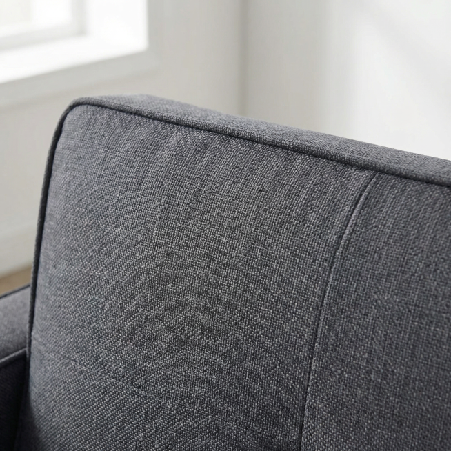 深灰色布艺双人沙发布料纹理局部特写，保持产品原材质和纹理样式不变，特写展示沙发坐垫的布料编织纹理，清晰呈现织物的经纬纹理和哑光质感，放在干净的室内环境，柔和自然光，商业产品细节摄影，8K分辨率，极高清预览效果