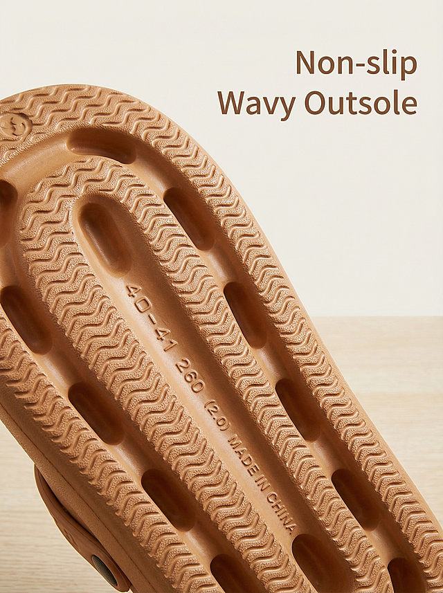 [Main Image 3] Detail display of sole: close-up shot of this caramel holeless clog shoe's sole, showing the wavy non-slip texture and size marking. Background is minimalist light wood grain. Text "Non-slip Wavy Outsole" placed on upper right blank, simple sans-serif font, color pick from shoe dark brown. Product must be consistent with original sole texture, the shoe is holeless. Soft studio lighting, clear texture detail.