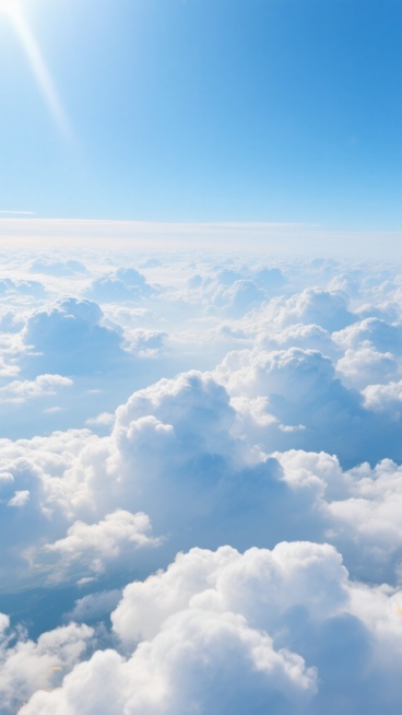 从高空广角镜头下，纯净蓝白主色调的壮丽云海实景，无数蓬松如棉花糖的积云铺展，边缘阳光金边柔和，部分透深邃蓝天，明亮自然光下光影细腻有体积感层次，柔软弹性半透明轻盈，远处云层渐模糊融天际，干净现实逻辑的背景云海素材预览效果
