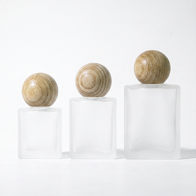 [主图-1] Frosted Glass Roller Bottle with Solid Wood Cap product main image. [Atmosphere Style] Advanced minimalist style, fresh and natural, clean and high-end. [Picture Quality] Commercial photography texture, soft and bright light, clear product details, real texture, super high definition. [Elements] Three frosted glass roller bottles of 10ML, 15ML and 30ML are placed in the center of the picture, with natural white wax wood spherical solid wood caps on the top, showing the product clearly. Keep the appearance (physical structure, material texture, color) of the product in the input image absolutely consistent, eliminate any deformation and color difference, and finely process. The product occupies more than 85% of the picture, with a full screen and no border. [Light and Shadow] Soft front natural light, bright and bright, delicate matte texture of frosted glass, natural wood grain texture highlight, soft transition of light and shadow, no harsh shadows. [Color Matching] Mainly pure white bright background, auxiliary with natural wood color of solid wood cap, overall light bright, simple advanced. [Perspective Composition] Flat head-up perspective, the product is centered and prominent, the composition is symmetrical and stable. [Proportional Resolution] 1:1 ratio, 2K resolution, super clear. [Negative Prompt] Deformation, watermark, text disorder, blurred product image, messy background.