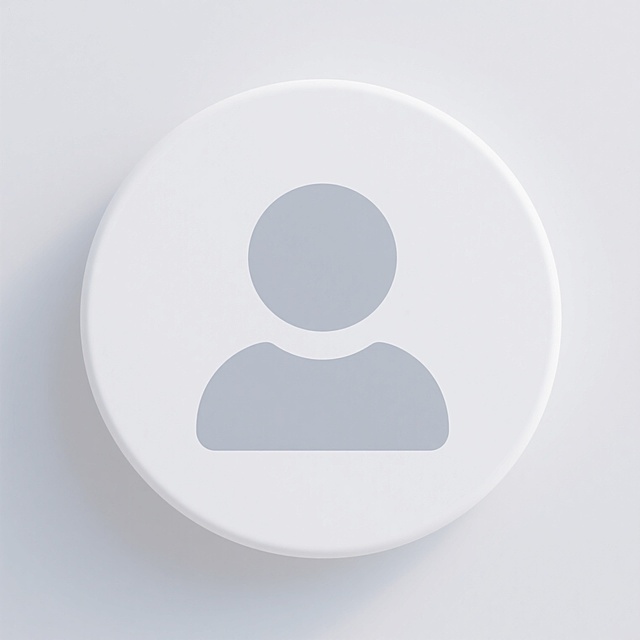 极简主义风格用户头像图标，白色圆形背景，中央为一个由浅灰色圆形（代表头部）和白色半圆形（代表肩部/身体）组成的抽象人形符号，整体采用平滑的数字矢量图形绘制，边缘锐利清晰，无渐变、阴影或纹理，色彩仅有白色与单一浅灰色，构图居中对称，视觉元素高度简洁，信息传达直接明了，符合现代UI/UX设计中的简约图标设计规范。