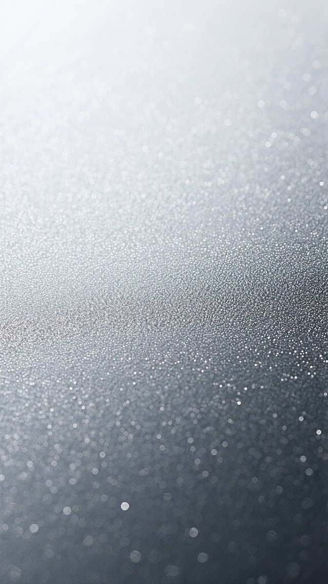 一张具有细腻磨砂质感的银色背景图片，整体呈现从顶部的银白色向底部的深灰色自然过渡的渐变效果，表面布满均匀且精致的细微颗粒纹理，不同区域的纹路在保持整体和谐的基础上展现出微妙的变化，部分区域纹路略粗形成轻微的肌理对比，光线从左上角柔和照射，使银色表面呈现出细腻的高光与阴影层次，营造出冷静、现代且富有高级感的金属质感氛围。