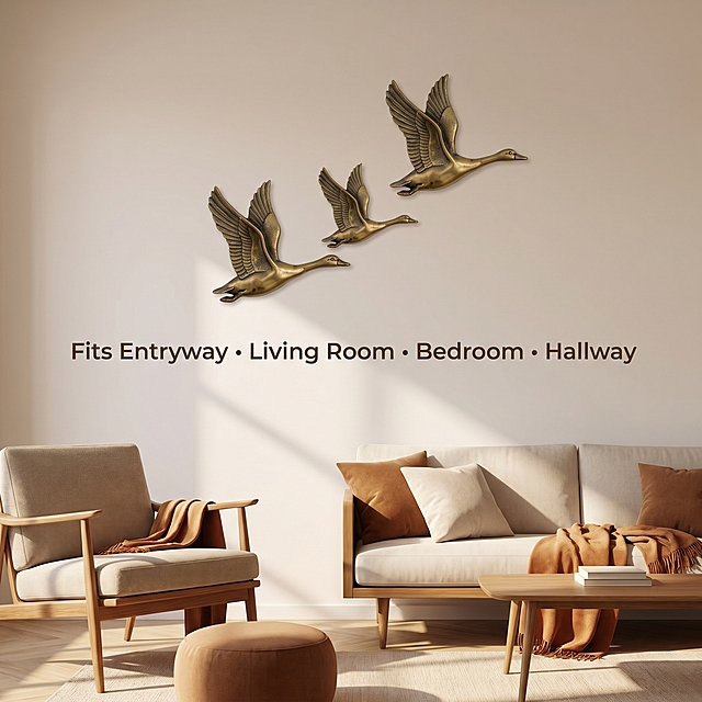 [Main Image 5] Multi-scene Adaptation Display. Keep the product appearance (physical structure, material texture, color) absolutely consistent with the input product image, eliminate any deformation and color difference, fine processing. 3-piece flying geese wall decor arranged staggered on a mid-century neutral living room wall, show the real home installation effect. Simple retro space with light coffee off-white wall, warm natural afternoon light, highlight the product's retro brass texture and advanced atmosphere. Text placed in bottom: 'Fits Entryway • Living Room • Bedroom • Hallway', clean sans-serif font, dark bronze color, evenly distributed. Simple clean style, 1:1 square, 2k resolution, commercial real estate photography. Negative prompt: deformation, watermark, text clutter, product image blur, background clutter.