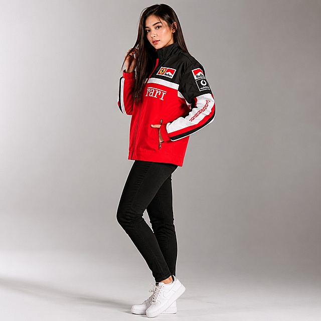 Amazon main image 2, side view of model wearing the red black white embroidered racing jacket. Same beautiful young female model with long straight hair, same makeup, same black slim pants and white sneakers. Model standing in 45 degree side profile, one hand in pocket, other hand touching hair, body slightly turned, showing the side silhouette and sleeve embroidery details clearly. Minimalist indoor studio with light gray gradient background, soft box lighting from left side, creating gentle shadows. Moto racing style aesthetic, cool and stylish vibe. Commercial fashion photography, ultra realistic, high detail fabric texture, crisp embroidery. 1:1 square format. No text, no logos, no watermarks.