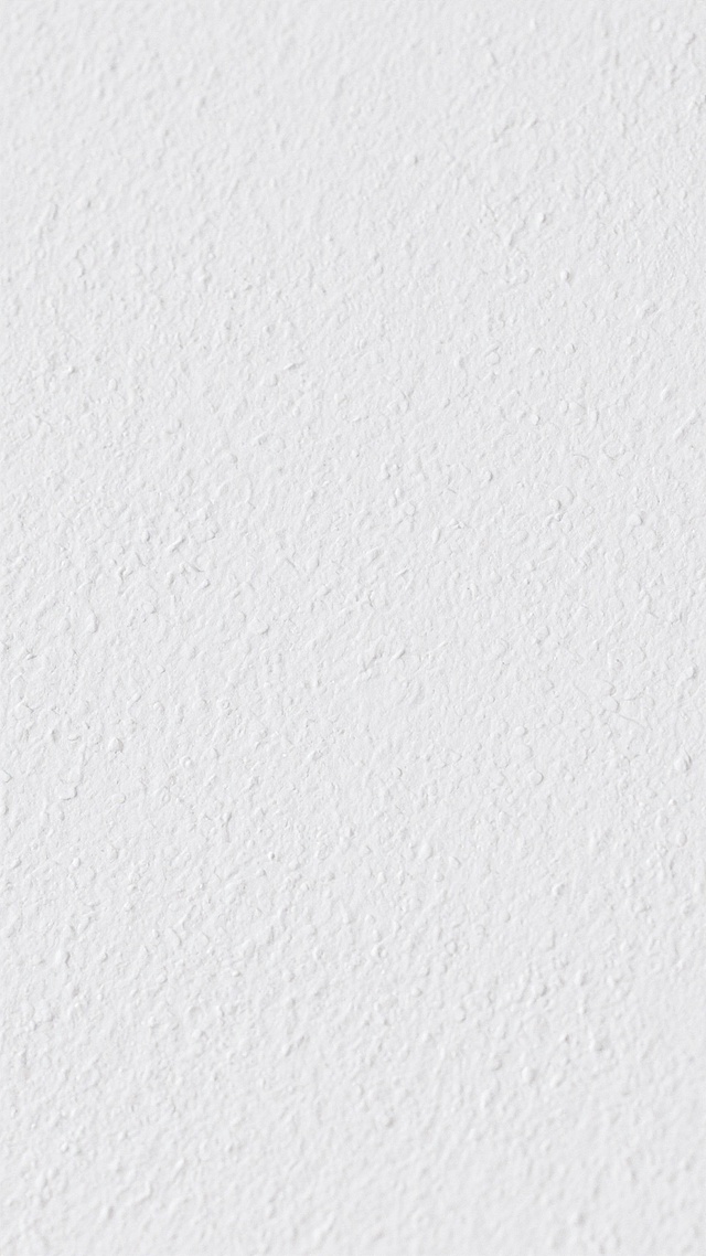 纯白色背景，表面带有细腻均匀的浅灰色纹理，纹理呈现出不规则的微小颗粒感和细微的凹凸质感，整体色调统一为干净的白色，无其他图案或元素，保持简洁、素雅的视觉效果，具有类似纸张或墙面的自然肌理。