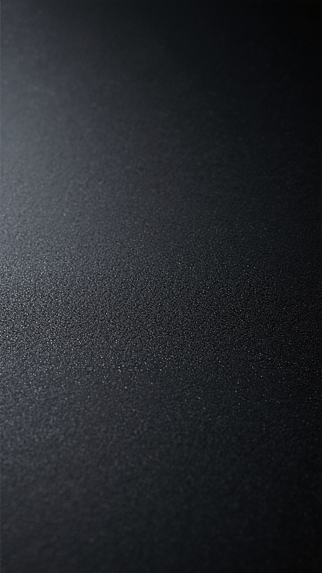 纯黑色背景，具有细腻均匀的磨砂质感纹理，整体呈现出深邃沉稳的氛围，色调统一为纯黑色，表面带有细微的颗粒感，光线柔和不产生明显高光和阴影，保持简洁纯粹的视觉效果，无任何图案或装饰元素，仅展现不同的黑色磨砂纹路细节。