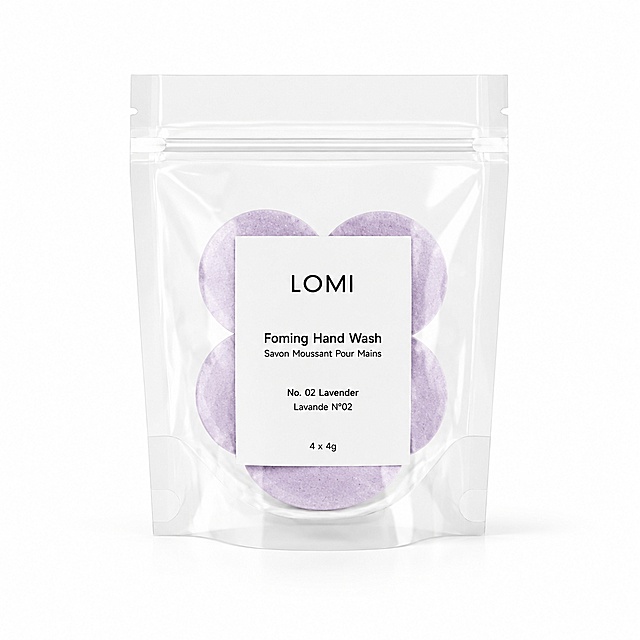 提取图中一个透明自封袋，在袋子正面贴上标贴，标贴文字为：LOMI Foming Hand Wash Savon Moussant Pour Mains No. 02 Lavender Lavande N°02 4 x 4g，袋子里面装着4片紫色泡腾片，纯白背景，白底图，干净简洁