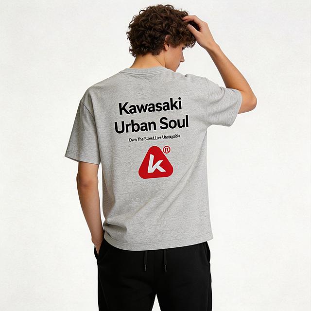 将第一张图片中的浅灰色Kawasaki印花T恤替换到第二张图片的男模特身上，保持T恤原有印花和质感，调整模特姿势为左手轻撩头发，右手自然插兜，T恤下摆自然下垂，将模特的裤子修改为纯黑色休闲卫裤，背景保持纯白色不变