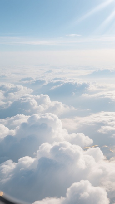 超写实航空摄影低角度广角镜头呈现纯净白色与淡蓝色为主的壮丽云海，蓬松厚实如棉花糖的云层具柔软弹性质感，前景积云形态分明边缘清，中景云海连绵似波浪，远景融入天光，光线从间隙倾泻形成柔和漫反射及云层边缘金边与阴影层次，通透感强、空气纯净，尽显置身云端俯瞰仙境之景的干净现实风格背景素材用提示词。预览效果