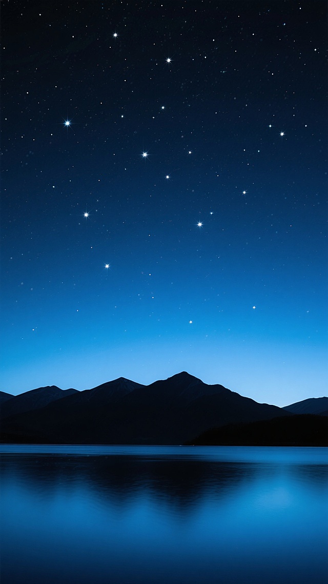 深邃的夜空背景，从上到下呈现由深蓝到浅蓝的渐变色彩，无数明亮的星星点缀其中，大小不一，疏密有致，如同洒落在黑色丝绒上的碎钻，夜空下是轮廓清晰的深色山脉剪影，山脉底部是平静如镜的深蓝色水面，整体营造出宁静、浩瀚、神秘的氛围，色调统一为深蓝色系，光影柔和，具有写实的星空摄影质感。