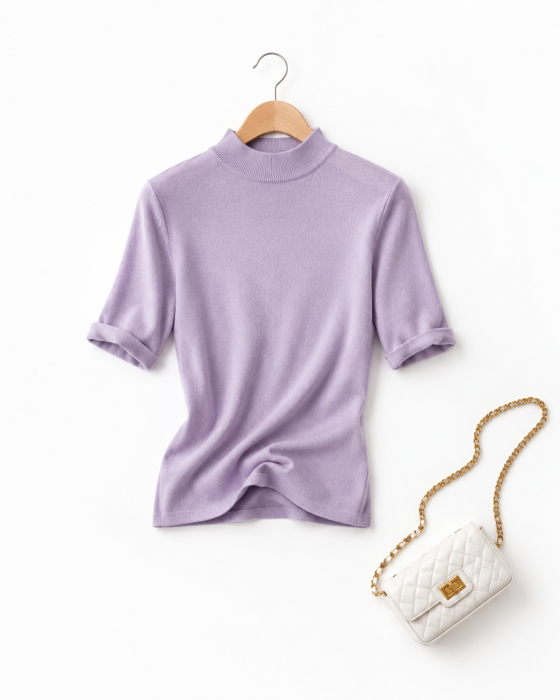 俯拍服装白底静物图，一件香芋紫色半高领针织打底上衣悬挂在原木色… - 图片创意预览