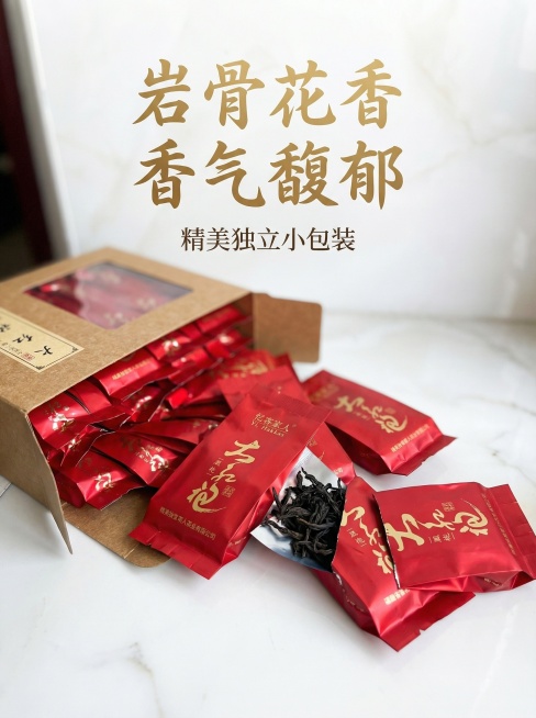 第二款拼多多平台大红袍茶叶详情主图，简约风格，展示拆开包装后独立小包装的大红袍茶叶小泡袋，突出小包装设计精美，核心卖点岩骨花香、香气馥郁，不能出现正岩、母树、产地直发等违禁词预览效果