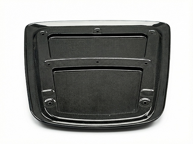 Professional e-commerce retouching for carbon fiber auto parts, precise intelligent cutout to retain the complete outline and carbon fiber texture details of the parts, no edge jaggedness/fringing/missing cutout, replace the background with pure high-definition white (#FFFFFF) without impurities; retouch and enhance the unique twill texture and matte/bright luster of carbon fiber, restore the high-gloss delicate texture of carbon fiber, optimize the three-dimensional light and shadow of the product (soft commercial lighting, no double image/no overexposure/no extra projection); repair tiny scratches/dust/fingerprints/water stains on the surface of the parts, brighten the product color without color cast, improve the image sharpness to ultra-clear, 8K ultra-high definition resolution, commercial product photography standards, pure white background without any extra elements, the product subject is centered in the composition, the texture of carbon fiber material is real and prominent, suitable for product display on Alibaba International Station/Amazon e-commerce platforms