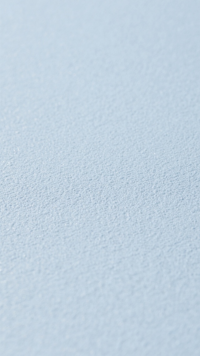 一张干净风格的材质纹理图片，整体呈现柔和的灰蓝色调，表面具有细腻、均匀且略带粗糙感的颗粒质感，纹理自然分布，没有明显的图案或花纹，光线均匀柔和，营造出简约、素雅、平静的视觉氛围，色调统一和谐，适合作为背景或材质展示使用。