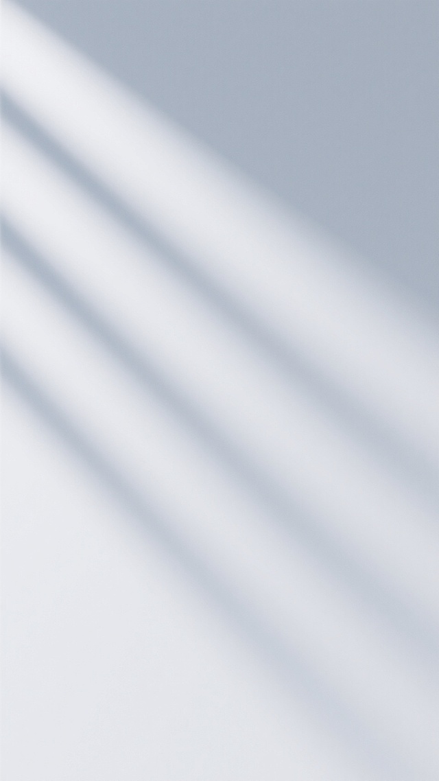 一张极简风格的海报，整体以柔和的浅灰色和白色渐变为主色调，光线从左上角以柔和的角度斜射下来，在画面中形成几条流畅、模糊且富有动感的浅灰色斜向光影条纹，光影过渡自然平滑，营造出宁静、简约且带有轻微科技感的氛围。画面干净整洁，没有任何文字、LOGO或其他元素干扰，留白充足，视觉焦点集中在光影本身的流动感和层次感上，整体设计极简、现代，具有高度的视觉统一和信息传达效率，适合追求简约美学的受众。