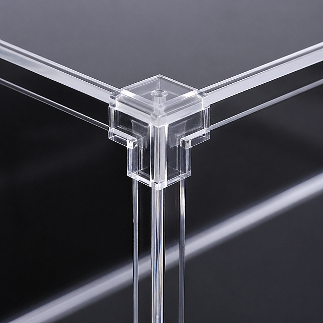 Close-up shot of the corner connectors of the acrylic display case, highlighting the sturdy and secure connection, clear and sharp details, 1:1 square ratio for e-commerce.