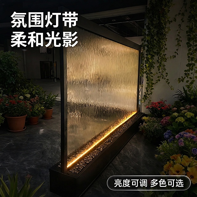 [主图 2] 水幕墙LED暖光氛围效果展示
[氛围/风格] 氛围感高级质感，夜晚暖调，突出光影效果。
[画面元素] 保持原有产品外观不变，展示水幕墙在傍晚室内空间的灯光效果，底部暖光LED灯带照亮水幕，水流被暖金色光线晕染出通透层次感，周围环境稍暗，突出产品灯光和流水的柔美结合，光影风格统一。
[配色色系] 主调：黑色边框+暖金色灯光，深色背景衬托光影效果。
[视角构图] 正面中景特写，突出灯光和水幕结合部位，焦点清晰。
[文字版式] 左上角主标题 “氛围灯带 柔和光影”，加粗白色文字适配暗调背景；右下角胶囊标注 “亮度可调 多色可选”，白字半透黑底，信息清晰不遮挡主体。
[比例分辨率] 1:1 比例，2k 分辨率。