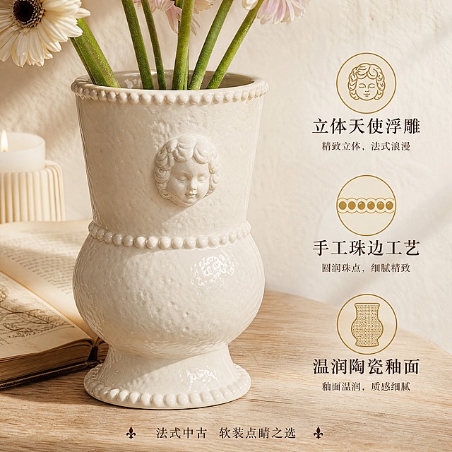 [主图-2] 法式复古天使浮雕陶瓷花瓶 材质细节与卖点展示图。
[统一基调] 法式复古高级感，奶白+深棕+柔金配色，衬线字体标题，柔和午后自然光，统一法式奶油家居背景，米白肌理墙面+浅木色家具，光源从左上方来，整体暖调温馨。
[画面] 法式复古天使浮雕陶瓷花瓶近景特写，平视微俯视角，主体占比约70%。重点展示瓶身正面的立体天使人像浮雕细节，浮雕五官清晰、发丝纹理细腻，周围陶瓷釉面温润有光泽。瓶口珠边圆点装饰清晰可见，珠粒圆润饱满。花瓶放置在浅木色桌面上，桌面有一本摊开的复古书籍与一支蜡烛作为陪衬，背景虚化的奶油色墙面。画面右侧和下方留有空间放置卖点图标与文字。
[光影质感] 商业摄影质感，柔和侧光突出浮雕立体感，陶瓷釉面有细腻反光，浮雕凹陷处有自然阴影，材质肌理真实可触，底部有柔和接触阴影。
[配色] 主色奶白色陶瓷、深棕文字、柔金图标；背景浅木色+奶油白；整体暖调高级。
[文字版式] 画面右侧竖向排列三个卖点图标+文字：顶部"立体天使浮雕"配浮雕小图标，中部"手工珠边工艺"配珠点小图标，底部"温润陶瓷釉面"配陶瓷质感小图标；图标为柔金色线条风格，文字为深褐色衬线字体，主词大、说明词小。画面底部有一行小字"法式中古 软装点睛之选"。文字均不遮挡花瓶主体。
[输出要求] 1:1正方形，2K分辨率，产品细节清晰，文字图标清晰可读；禁止变形、错字、模糊、杂乱、水印、平台Logo、多余手指、穿模。