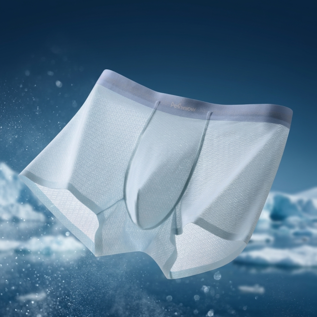 高端男士冰丝提花内裤电商产品摄影，冷色调极简风格。背景为深邃冰川蓝渐变，远处隐约可见冰山轮廓与漂浮冰块，前景有细腻水雾与冰晶散景，柔光散焦，背景虚化不抢主体。内裤呈自然悬浮状态，居中构图，3D立体版型预览效果