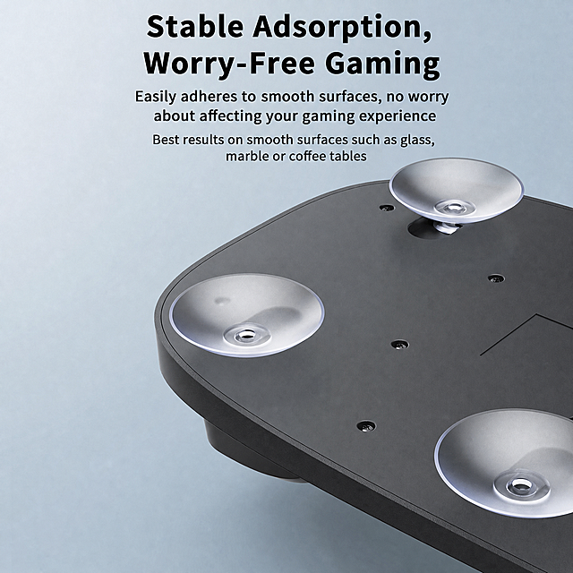 将图片中所有中文替换为英文：标题'稳固吸附 玩耍无忧'改为'Stable Adsorption, Worry-Free Gaming'，正文'轻松吸附光滑物体表面，无需担心影响游戏体验'改为'Easily adheres to smooth surfaces, no worry about affecting your gaming experience'，括号内容'【在玻璃、大理石或茶几等光滑表面吸附使用效果最佳】'改为'Best results on smooth surfaces such as glass, marble or coffee tables'，保持产品展示、整体排版和色调不变