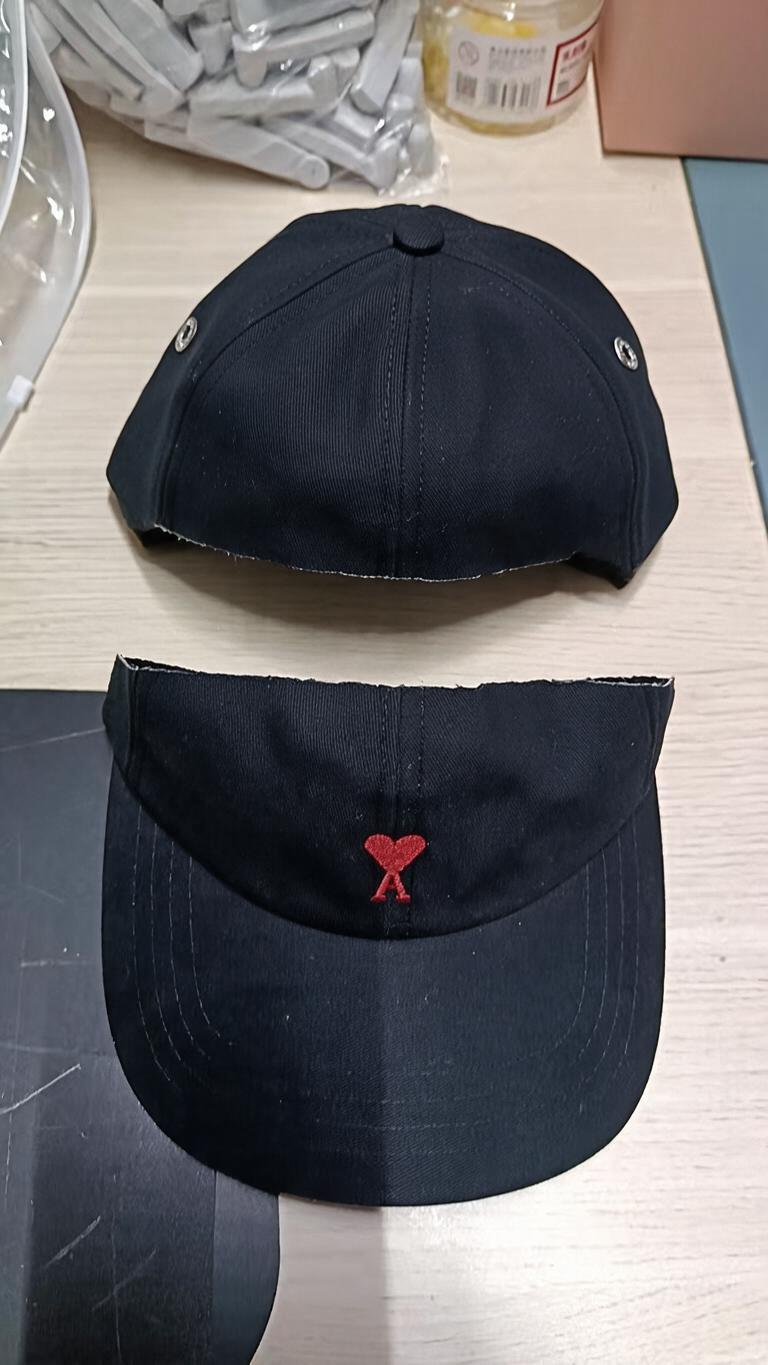 A black six-panel baseball cap… - 图片创意预览