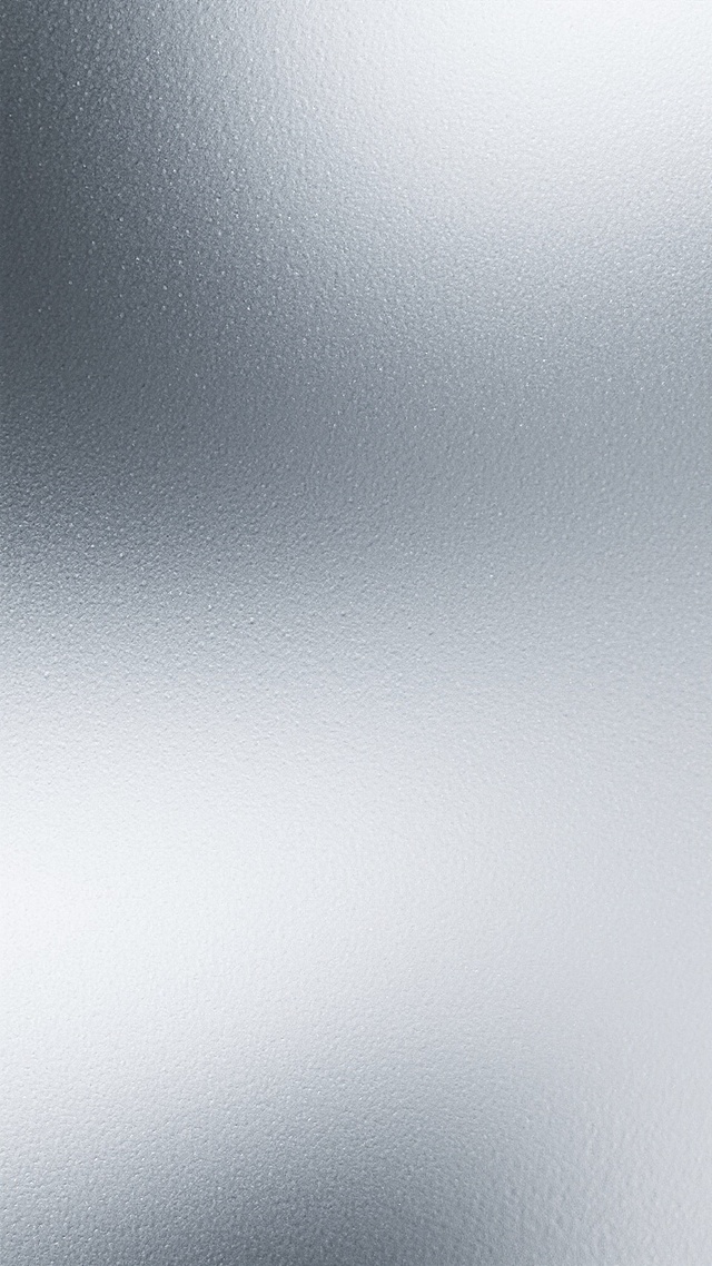 银灰色调磨砂质感背景，呈现细腻颗粒纹理与柔和光影过渡，整体为平滑渐变的金属色泽，具有现代简约风格的抽象纹理设计，无任何文字或图案元素，仅保留纯粹的银白至深灰的色彩层次与磨砂材质的触觉视觉感。