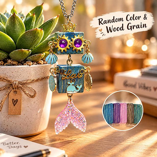 Amazon cross-border e-commerce main image, 1:1 ratio, scene display image, no white background. The product is a cute steampunk wooden robot pendant necklace with blue wood grain square body, golden gear eyes with purple gems, golden crown on top, light blue shell earrings, 'Love' lettering, light blue whale decoration, and pink glitter mermaid tail pendant. Pendant size: 7cm long, 2cm wide, 1.5cm high. Creative scene: the pendant is hanging next to a small potted succulent plant on a desk, cozy daily lifestyle scene, warm afternoon sunlight, soft bokeh background. English text on the image: "Random Color & Wood Grain". Professional commercial photography, sharp focus, high detail, suitable for Amazon product listing.