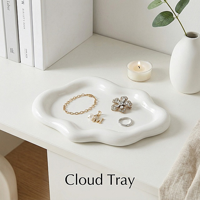 Keep the original cloud-shaped simple white jewelry storage tray unchanged, place it on a minimalist white shelf, the tray displays bracelets and brooches, clean bright shooting style, meet Shein's US selling requirements, picture text "Cloud Tray" with clean uniform font, highlight the product, increase purchase desire