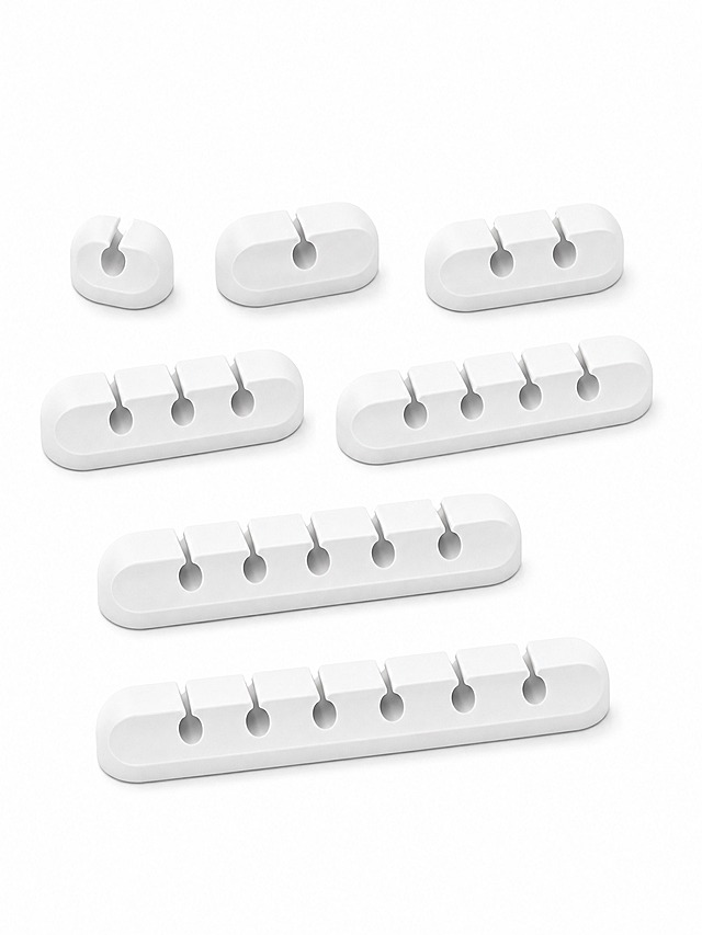 [主图-1] 7 Pack Cable Clips White Self-Adhesive Cord Organizer (1/2/3/4/5/6/7 Slots) 首图，纯白底产品英雄图，展示全套7个不同槽位的白色电缆夹整齐排列。
[统一基调] 亚马逊跨境白底首图风格，纯白背景，产品真实摄影质感，无任何文字、水印、边框和装饰元素。
[画面] 7个白色硅胶电缆夹按槽位数量从1槽到7槽整齐排列在画面中央，产品占画面85%以上，正面微俯视45度角拍摄，每个电缆夹的槽位结构清晰可见，硅胶材质表面细腻有哑光质感，底部有轻微自然接触阴影，产品完整不切割。
[光影质感] 商业棚拍质感，柔和均匀顶光，左右辅光消除硬阴影，硅胶材质呈现细腻哑光白，边缘清晰锐利，底部投影自然淡入白底。
[配色] 纯白背景，产品为纯净白色硅胶色，无其他杂色。
[文字版式] 首图无任何文字、标签、Logo或图形元素。
[输出要求] 比例3:4，产品清晰锐利，边缘干净，无变形、无悬浮、无穿模、无水印、无平台Logo、无中文。