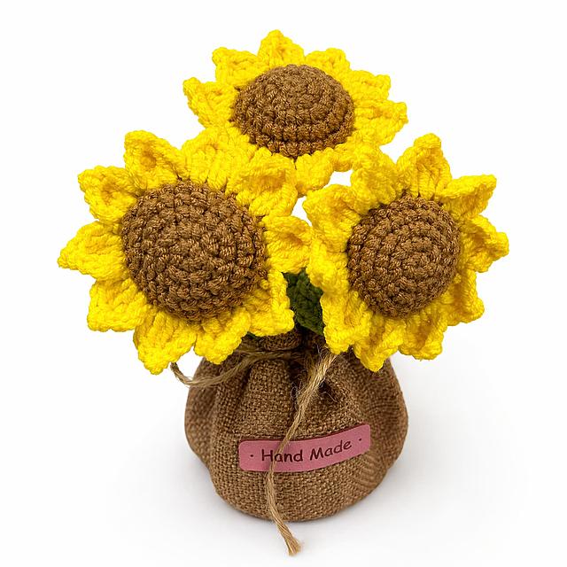 [Product 1 - Sunflower Potted] Handmade crochet sunflower pot. Pure white background #FFFFFF. Keep the original product's appearance, physical structure, yarn texture, and color consistent with the input image, no distortion or color difference. The product occupies more than 85% of the frame, centered. Commercial photography quality, soft and even light, clear and sharp product details, high-end and clean picture, 1:1 square, no other text or logos. Negative prompt: deformation, text confusion, blurry product, messy background, watermark, e-commerce platform logo, extra decoration